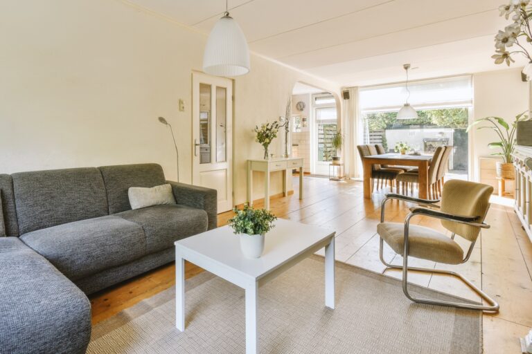 Studio flat with wooden floors and furniture in the concept of 'best affordable housing options in Canary Wharf'.