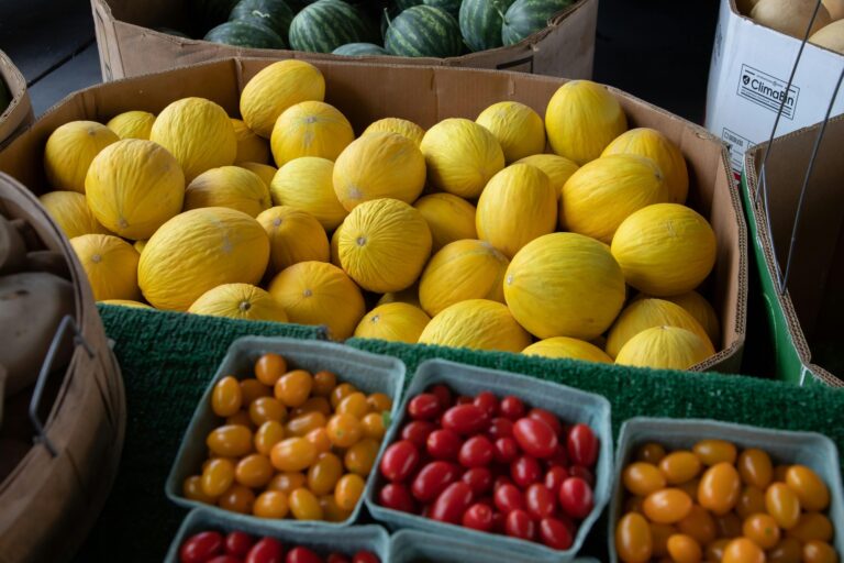 Variety of fresh produce in boxes in the concept of 'local shops and markets in Canary Wharf'.