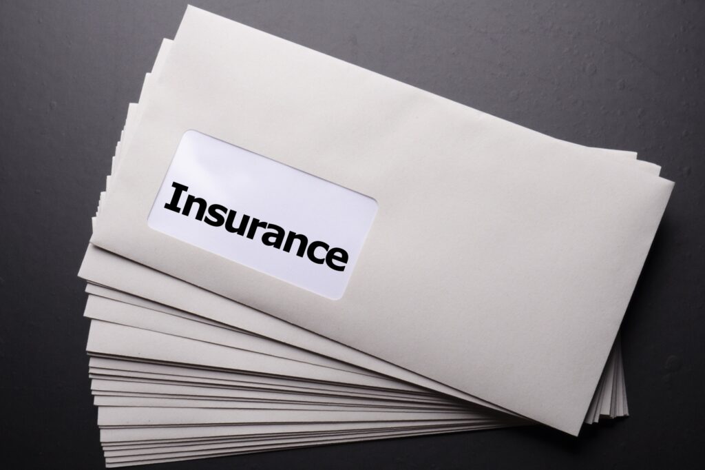 An envelope containing the insurance