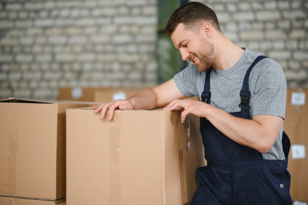 A professional mover is about to unpack the box