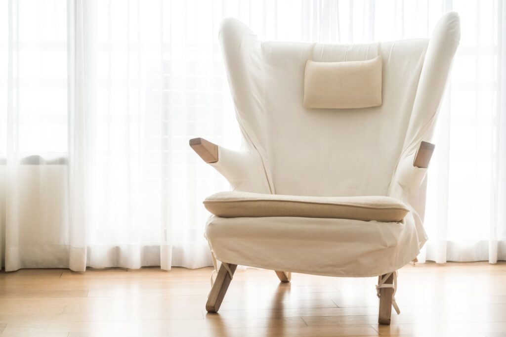 An armchair in a corner of the room after the relocation